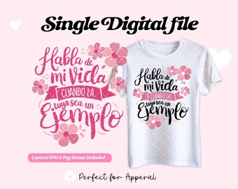 May include: A white t-shirt with a pink floral design and the text "Habla de mi Vida Cuando la tuya sea un Ejemplo" in black.