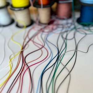 1.5mm Rayon Silky Twisted Cord. Super fine narrow silky cord, ribbon in lots of colours!