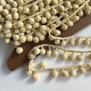 Crème pom pom bobble trim, heldere pom pom - verkocht per meter