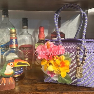 The Sacred Orchid – Tiki Purse with Tropical Flowers & Tiki Charm | Purple Woven Luau Handbag | Island Boho Beach Bag | Polynesian-Inspired