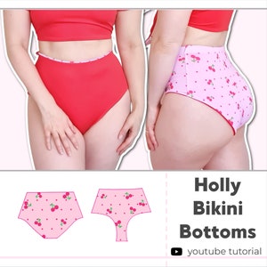 May include: A pair of high-waisted bikini bottoms with a cherry print. The bottoms are pink with red cherries and have a white trim. The image also includes a diagram of the bikini bottoms.