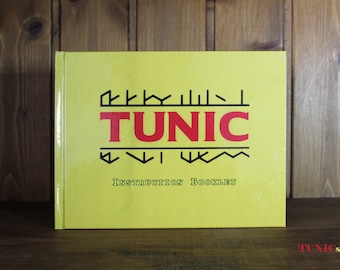 Livret d'instructions du jeu tunique : manuel à couverture rigide