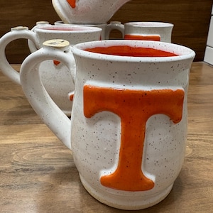 Mug, orange and white, Tennessee, handmade pottery