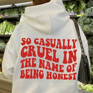 May include: White hoodie with a red graphic that says "So casually cruel in the name of being honest".