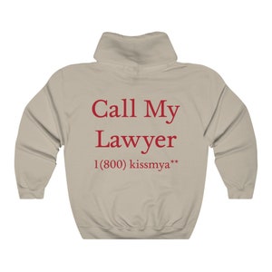 May include: A beige hoodie with a red print that says "Call My Lawyer 1 (800) kissmya**"