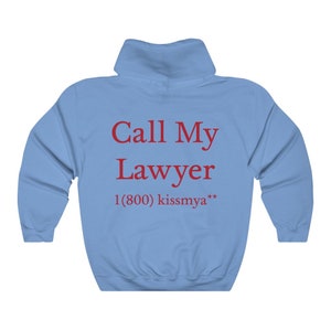 May include: Light blue hooded sweatshirt with the text "Call My Lawyer 1 (800) kissmya**" printed in red.