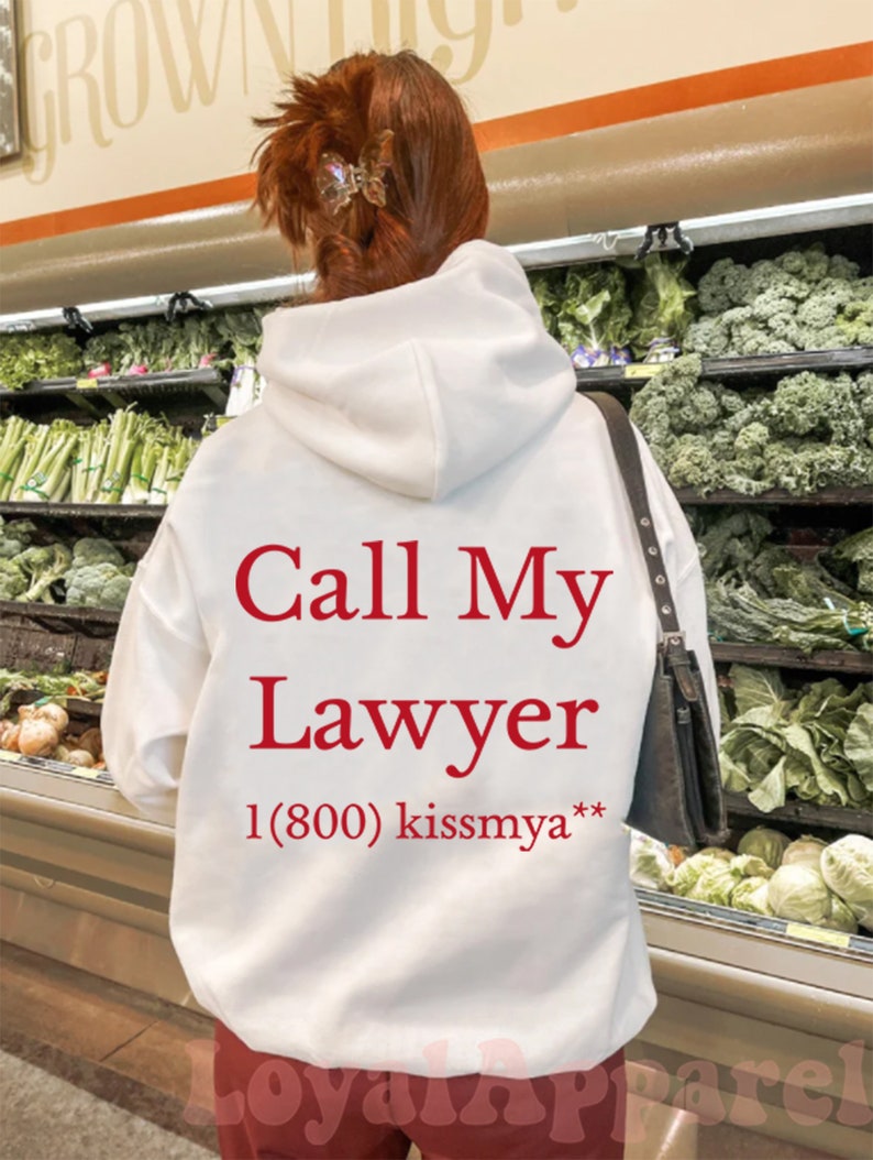 May include: White hoodie with red text that says "Call My Lawyer 1(800) kissmya**"