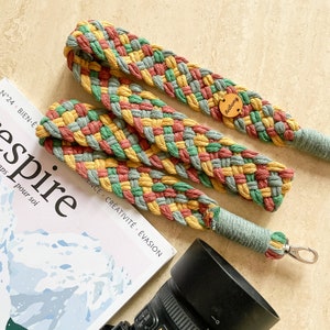 May include: A set of three ceramic mugs with a speckled, matte finish. The mugs are in shades of cream, light gray, and dark gray. Each mug has a simple, minimalist design, perfect for coffee or tea.