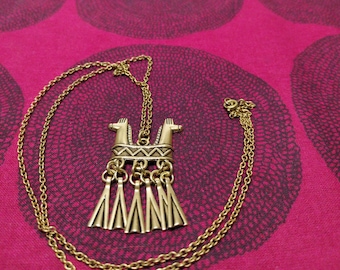 Rare two headed horse necklace made by Kalevala Koru in Finland