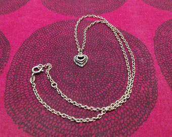 The Heart of the House silver necklace made by Kalevala Koru