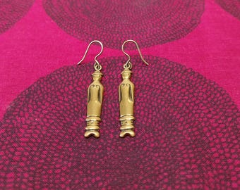 The doll earrings made by Kalevala Koru in Finland