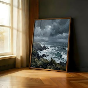 May include: A framed painting of a stormy sea scene. The artwork shows dark, brooding clouds, crashing waves, and rocky cliffs. The painting is in a wooden frame and leans against a dark wall, with a window and curtains visible.