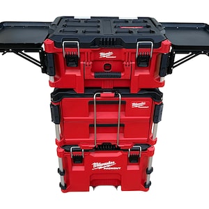 May include: A stack of three red and black toolboxes with a fold-out tray. The top toolbox has the text "Milwaukee Packout" on the front.