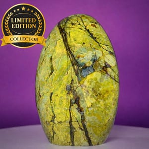 May include: A white ceramic mug with a black handle and the text "But First, Coffee" in a bold, black font. The mug is set against a blurred background, suggesting a cozy setting.