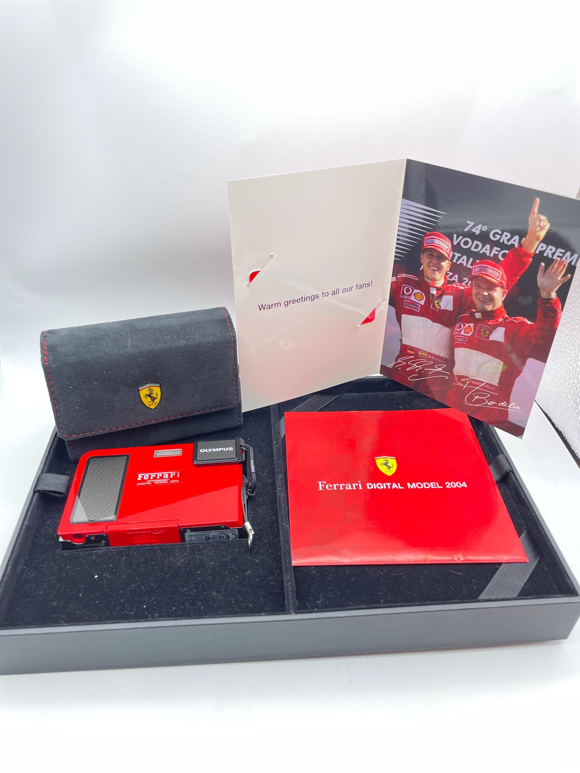 デジタルカメラ Olympus Ferrari Digital Camera 2004 First LookOlympus' Ferrari Digital Model 2004The Ultimate Pit Walk