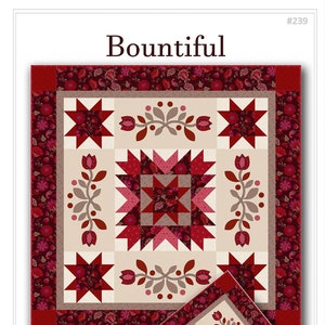 May include: Quilting pattern for a Bountiful wall hanging and table runner. The pattern features a red, white, and brown color scheme with a star and floral design. The pattern includes instructions for a 45-inch square wall hanging and a 26 1/2-inch by 59 1/2-inch runner.