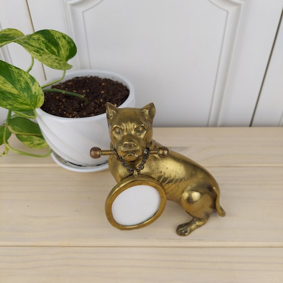 Vintage Brass Dog Holding a Bone With a Suspended Picture Frame