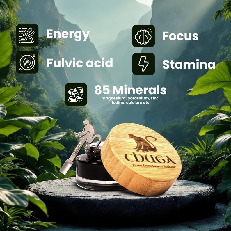 May include: A glass bottle with a black liquid and a bamboo lid with a monkey logo. The bottle is labeled "CHUGA Dove Dimologo Stikele". The bottle is surrounded by green foliage and the text "85 Minerals magnesium, potassium, zinc, iodine, calcium etc" is visible above the bottle.