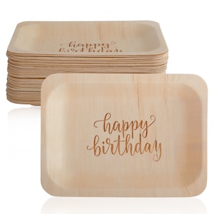 May include: A stack of 25 natural brown palm leaf plates with a "happy birthday" inscription. The plates are disposable and eco-friendly.