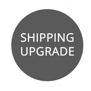 May include: A gray circle with the text "SHIPPING UPGRADE" in white.