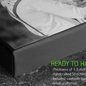 a black and white photo of a baby in a box