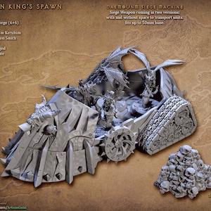 May include: A gray plastic model of a demon siege machine with a dragon head and wings. The model is on a brown background with text that reads "The Demon King's Spawn" and "Daemon Siege Machine".