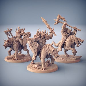 May include: Three beige fantasy miniatures depicting armored warriors riding monstrous beasts. Each figure wields a weapon, including swords and axes. The riders are adorned with helmets and shields, ready for battle. The miniatures are set on circular bases.