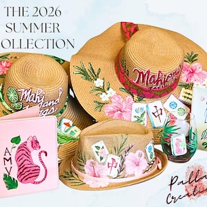 May include: The 2026 Summer Collection features several straw hats with floral and Mahjong tile designs. A pink passport holder with a tiger illustration and two decorated glasses are also displayed.
