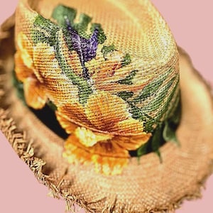 May include: A white ceramic mug with a black handle and the text "But First, Coffee" in a black, bold font. The mug is sitting on a wooden surface.