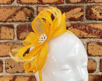 New yellow sinamay loop bow fascinator headband with feathers and pearl bead centre