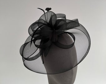 Black round fascinator headband and clip with a loop design centre and feathers