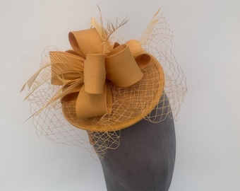 Golden Yellow netted round loop fascinator headband and clip with added feathers
