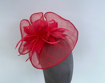 Coral Feather flower fascinator headband and clip on a round wavy base