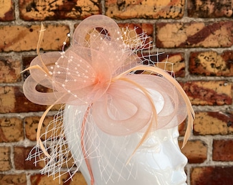 New peach tubular flower bow fascinator with beads and net lace headband and clip