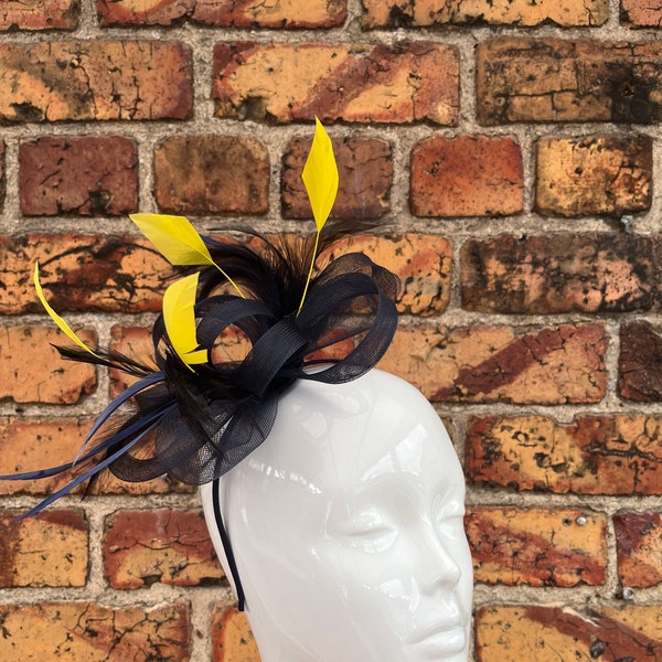 New navy blue loop bow fascinator with added yellow trimmed feathers headband and clip