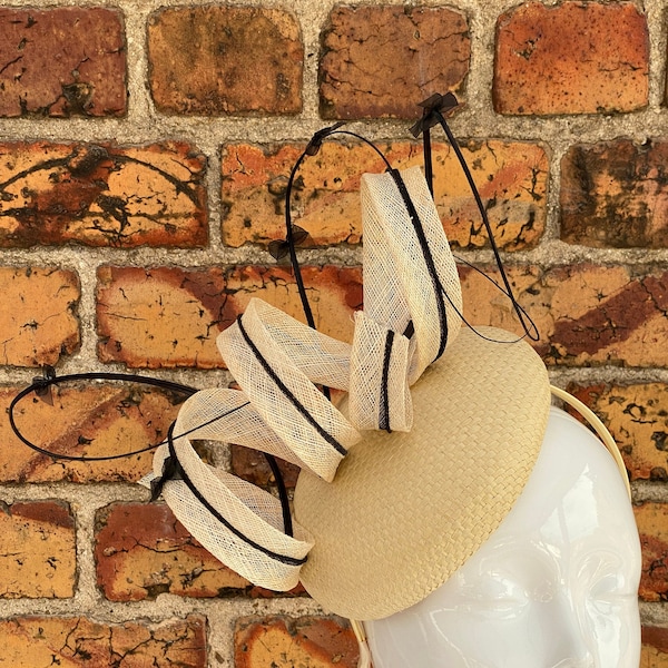 New cream spiral design fascinator headband with stripped quills and bows
