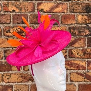 Large sinamay bright Pink looped fascinator hatinator headband with added orange feathers