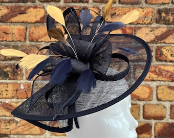 Large sinamay navy blue looped fascinator hatinator headband with added gold feathers