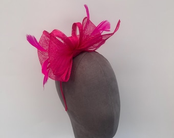 Cerise Pink sinamay looped bow fascinator headband with added feathers