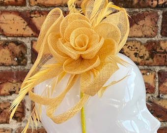 New yellow sinamay flower fascinator headband with added feathers and sinamay loops