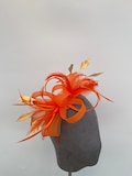 Orange loop bow fascinator with added Gold diamond trimmed feathers headband and clip
