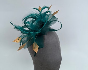 Dark green loop bow fascinator with added Gold diamond trimmed feathers headband and clip