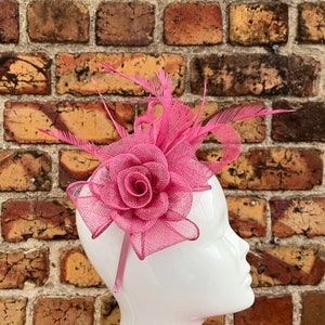 New raspberry rose flower fascinator headband and clip on a loop bow base with added feathers