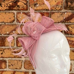 New blush pink bow shaped petal fascinator with feathers and crystal stamens