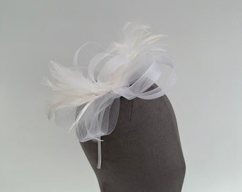 White loop bow fascinator headband and clip with added feathers