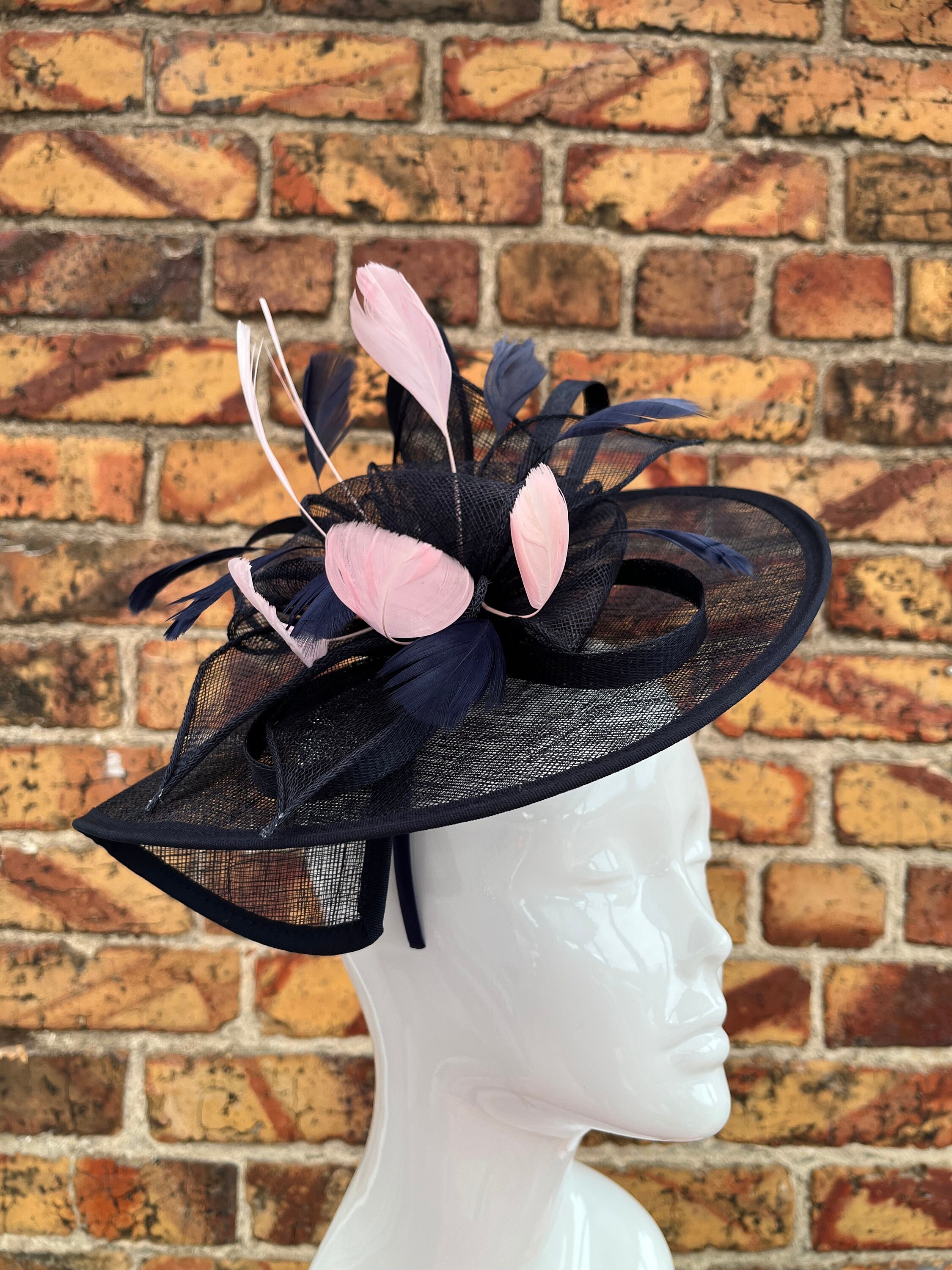 Large sinamay navy blue looped fascinator hatinator headband with pastel pink feathers