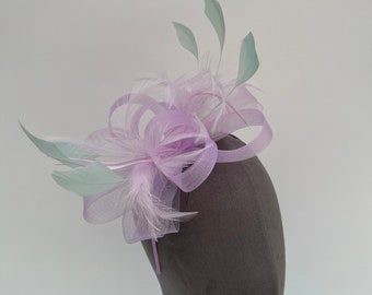 Lilac purple loop bow fascinator with added mint green diamond trimmed feathers headband and clip races hatinator