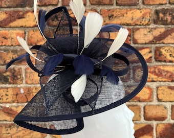 Large sinamay navy blue looped fascinator hatinator headband with cream feathers