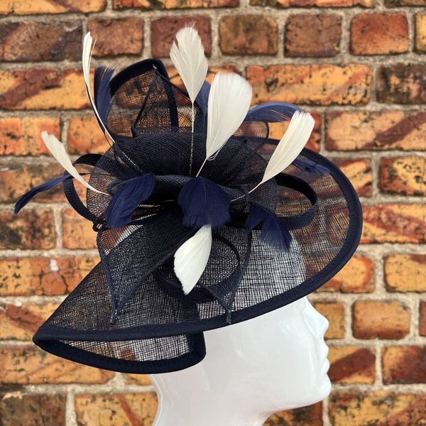 Large sinamay navy blue looped fascinator hatinator headband with cream feathers