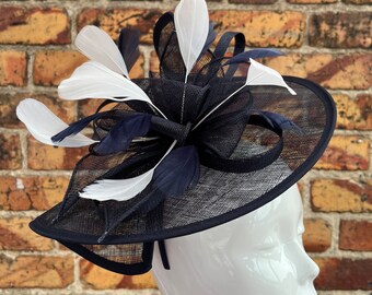 Large sinamay navy blue looped fascinator hatinator headband with white feathers
